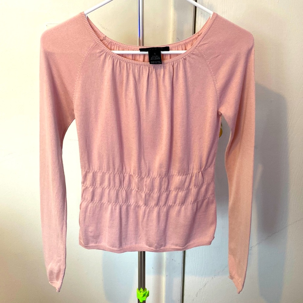 Pink sweater.